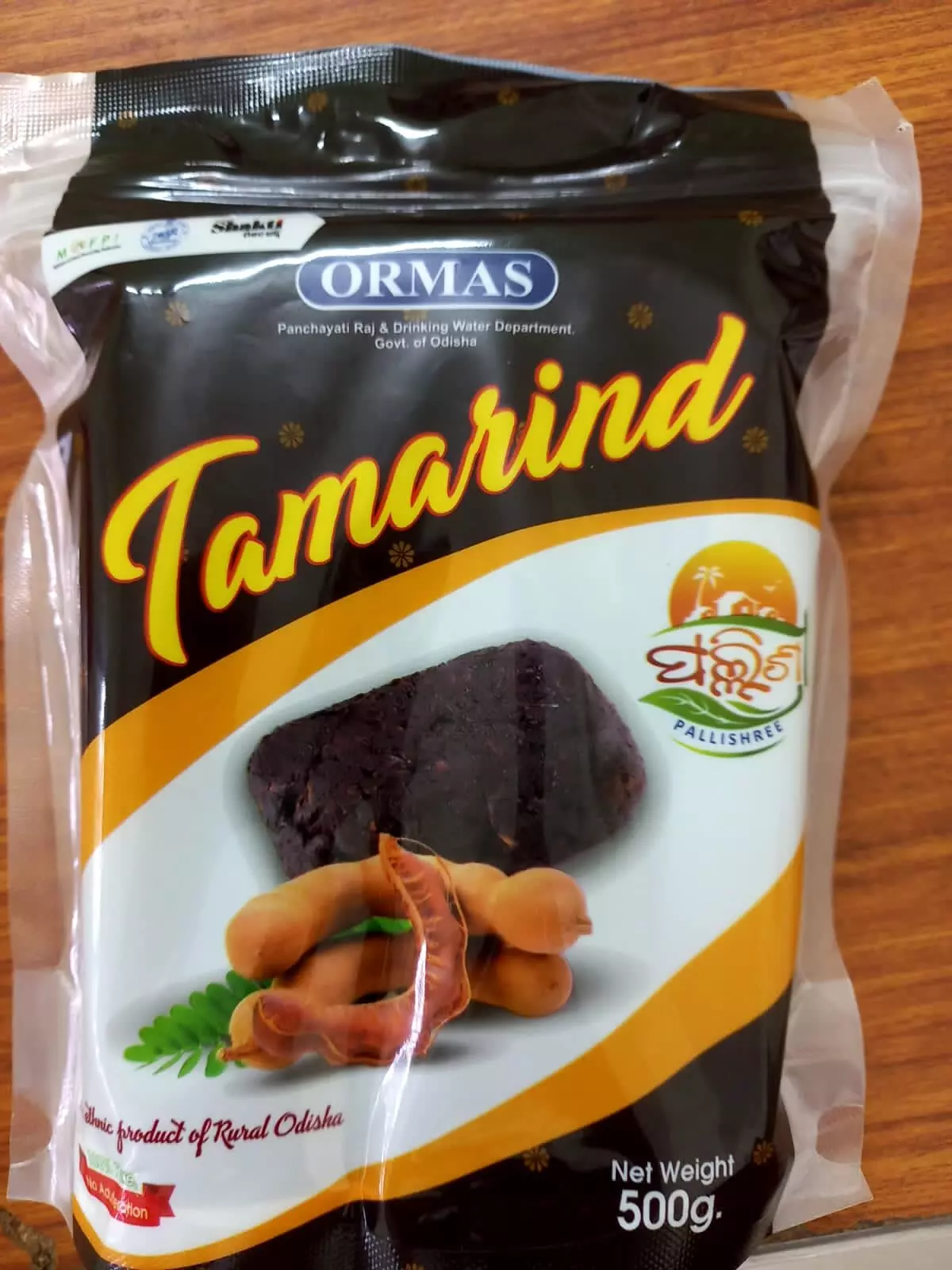 A packet of packaged tamarind cake produced by ORMAS.