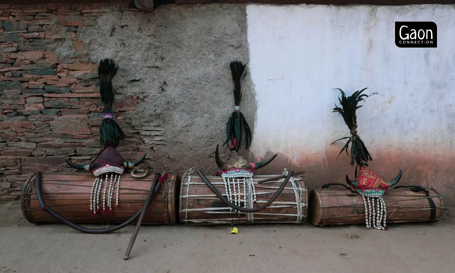 The men and women perform the bison horn dance with men playing the cylindrical mandar drum.