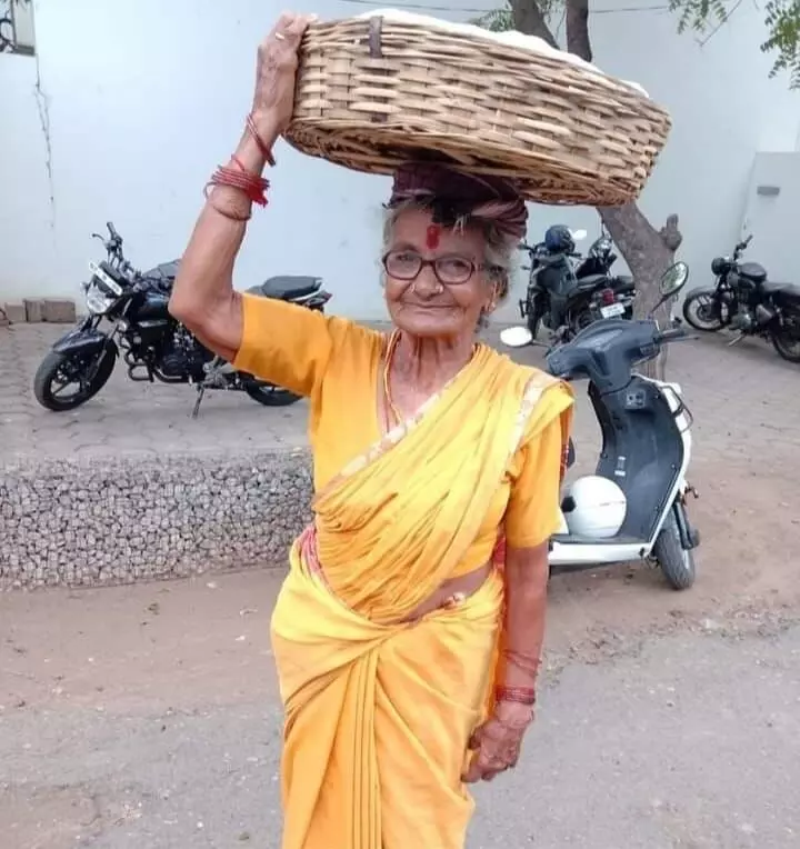 Karupaatha is always draped in a brightly coloured sari, a red bindi and bangles on her thin wrists.