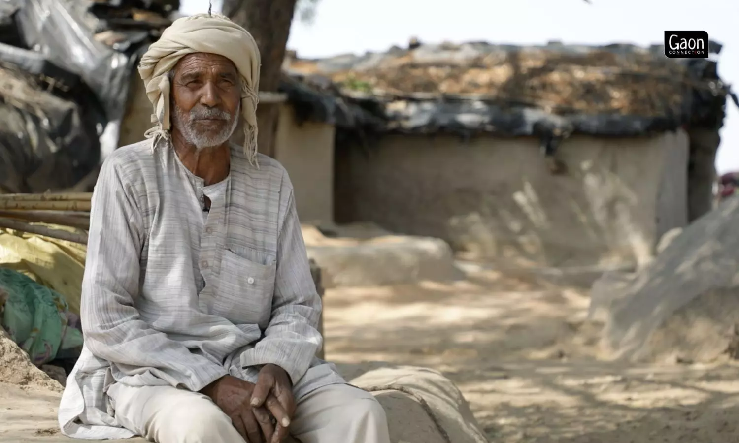 Swami Prasad Rajput, a farmer in Chandpura, Mahoba, sits outside his house telling about the benefits he is reaping from solar irrigation pump, which he paid for by borrowing money.