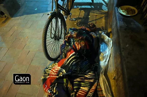 The rickshaw pullers often sleep beside their rickshaws to keep their source of livelihood safe at night.