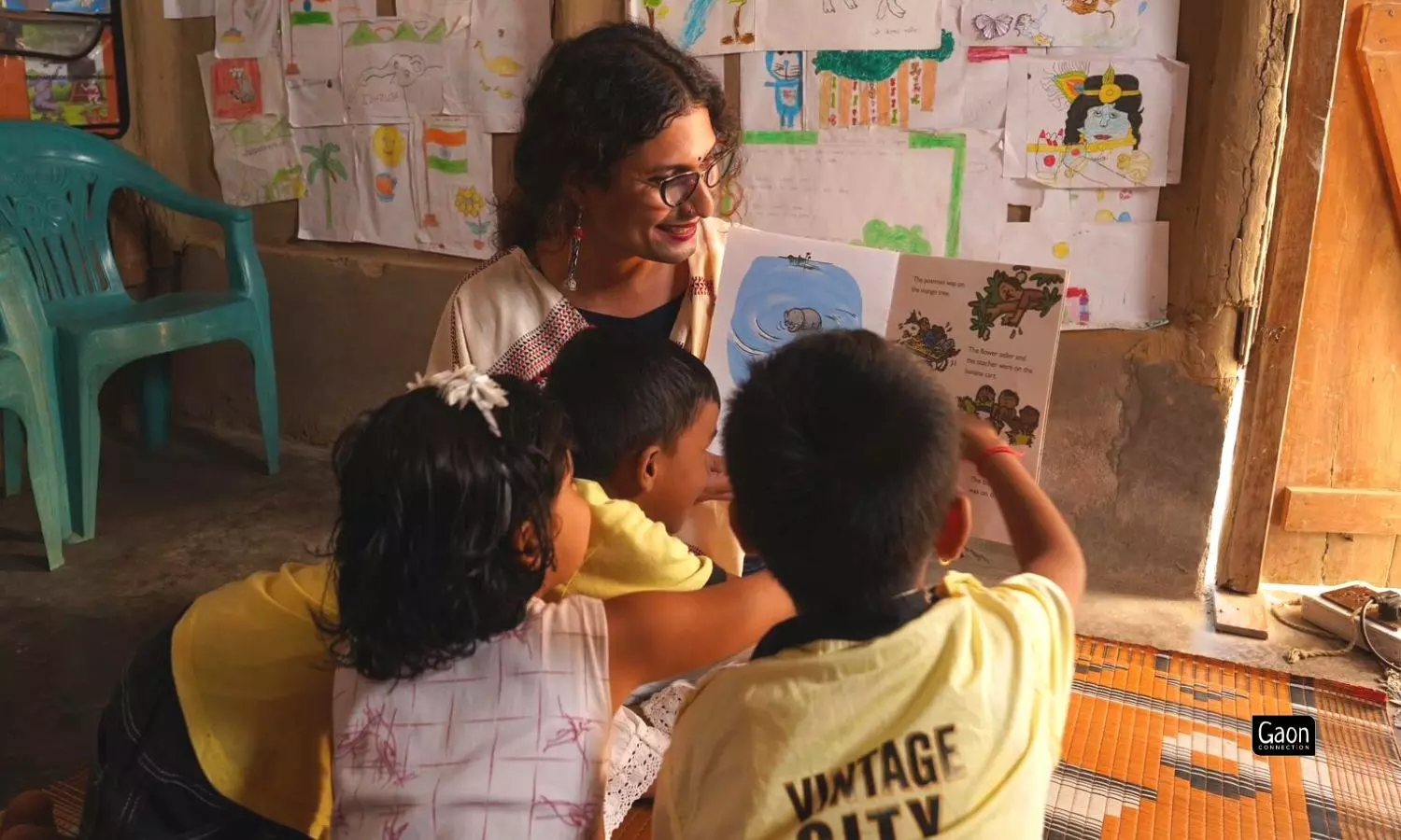 Rituparna Neog with children in the library. The library has around 2,000 books in English, Hindi and Assamese language.