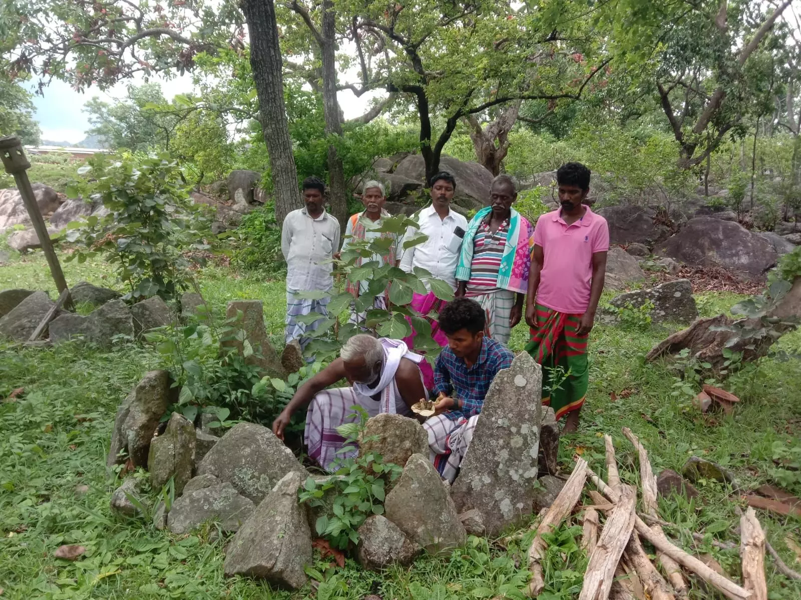 Village residents performing a ritual for Draupadi Murmus good fortune.