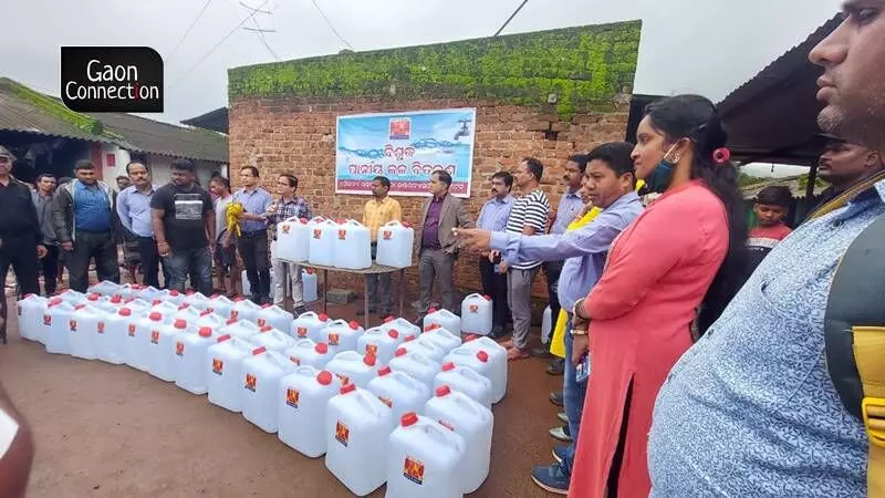 Clean water cans being distributed to check the cholera outbreak.