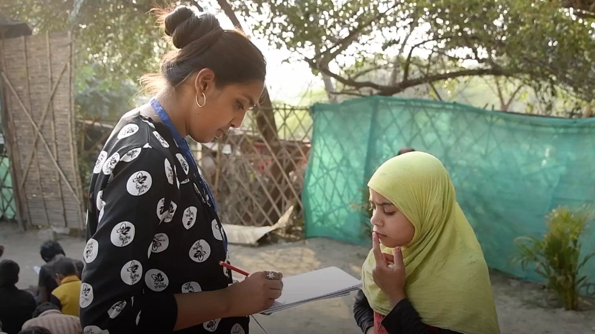 Suman, an 11-year-old student who is having her first experience of school.