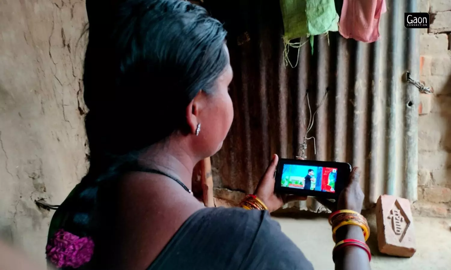 Mangli Bai has migrated from Chhattisgarh to work on a brick kiln in Uttar Pradesh. The mobile phone, the conversations with her daughters, and the movies and songs watches are the link with her home state.