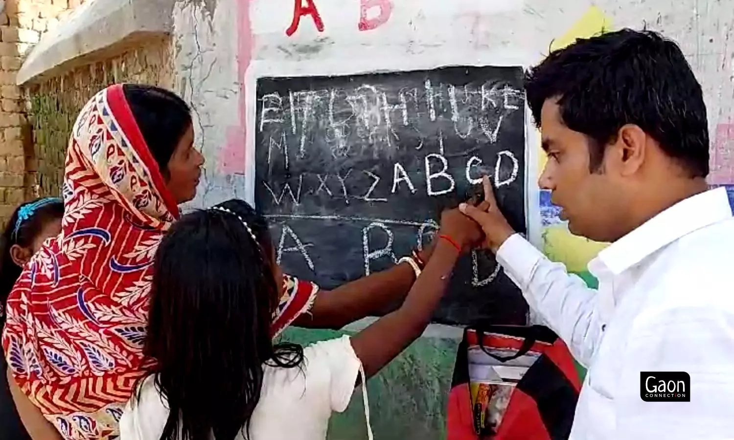 The teacher taught the women letters of the alphabet, numbers and how to sign their names. 